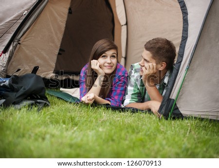 Couple resting in tent