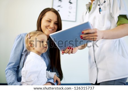 Doctor showing results on the tablet