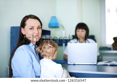 Mother and daughter with doctor in hospital