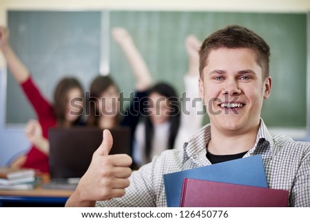Happy student showing OK