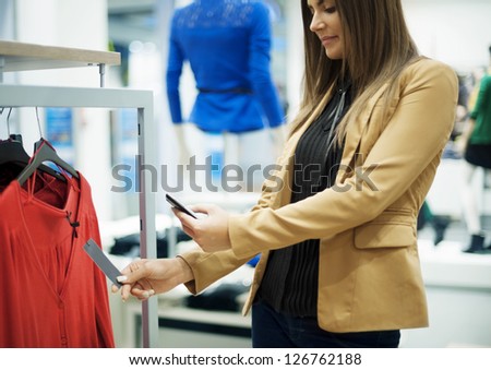 Smiling Woman Scanning Qr Code On Smart Phone