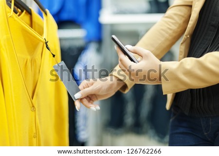 Woman Scanning Qr Code In Shopping Mall