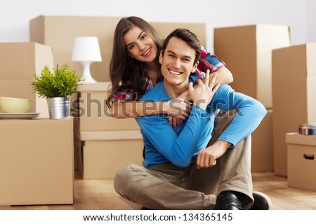 Portrait of happy couple in new home