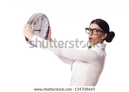 Shocked woman holding a office clock