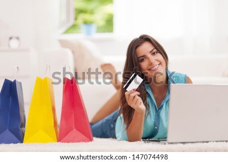 Beautiful Woman Paying By Credit Card For Shopping At Home