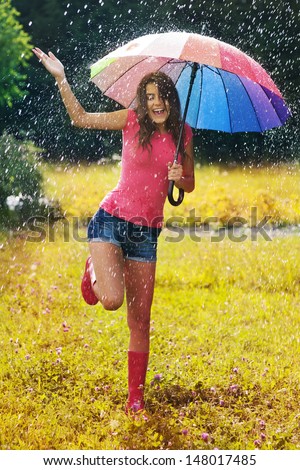 Young And Beautiful Woman Have Fun In Rain
