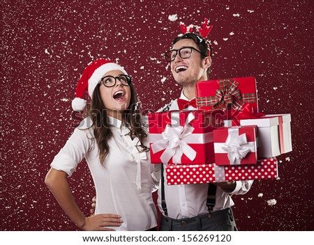 Happy nerd couple with christmas presents
