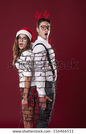 Funny Nerd Couple Are Tangling In Christmas Lights