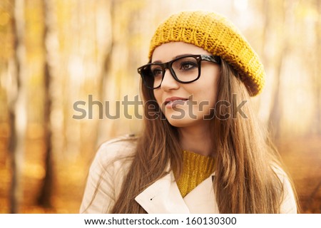 Portrait Of Beautiful Woman Wearing Fashion Glasses During The Autumn