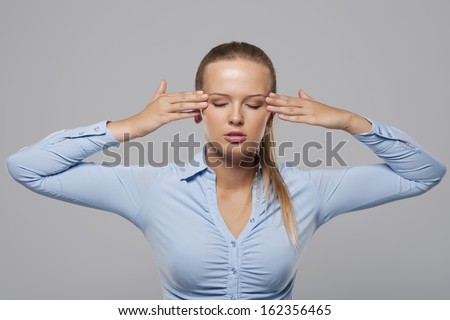 Young businesswoman with bad headache
