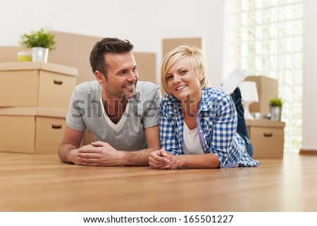 Portrait of smiling young marriage in new home
