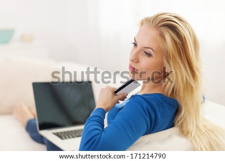 Woman wondering about online shopping