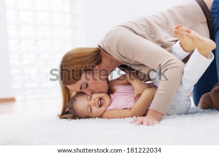 Mother playing with her baby Mother playing with her baby