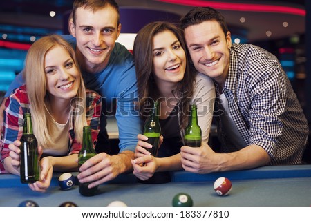 Party with friends in nightclub with billiards