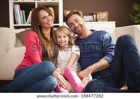 Portrait of loving family in living room