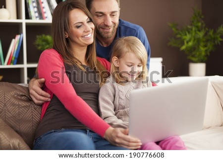 Happy family enjoying of modern technology