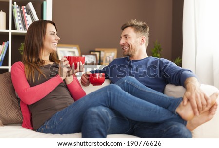 Lovely couple relaxing at home