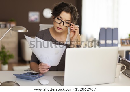 Young woman hard working at home