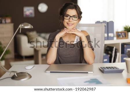 Portrait of beautiful woman in home office
