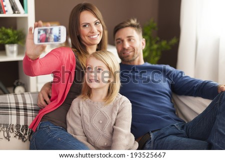Family taking self portrait photography by mobile phone
