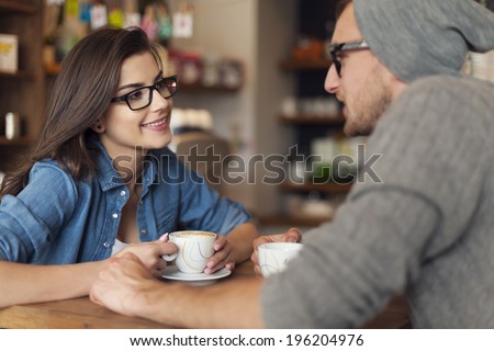 Loving couple on date at cafe