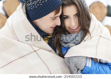 Snuggling up with a loved one in winter