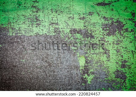 Damaged textured with green paint