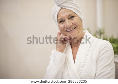 Senior woman with towel on her hair