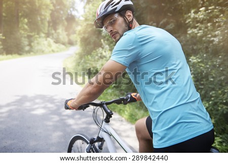 Adult man turning back on the road