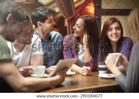 Meeting in small, climatic cafe