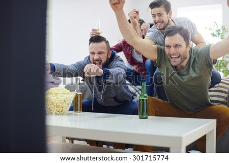 Men are proud of their team that won the game