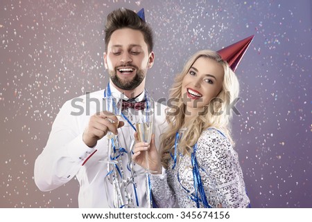 Young couple celebrating the New Year\'s Eve