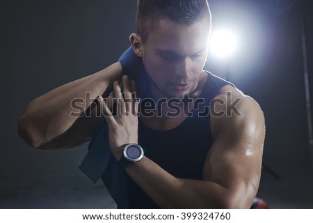 Sweaty man during training at the gym