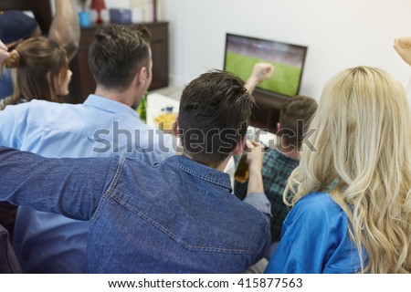 Fans of soccer watching match