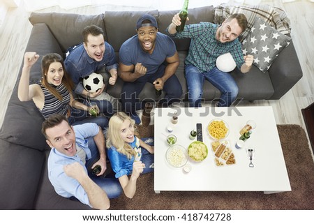 All of best friends watching football match