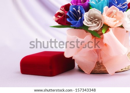 Basket with paper flowers and velvet box