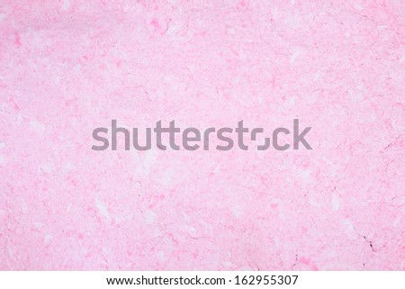 Handmade grunge pink paper background, close up