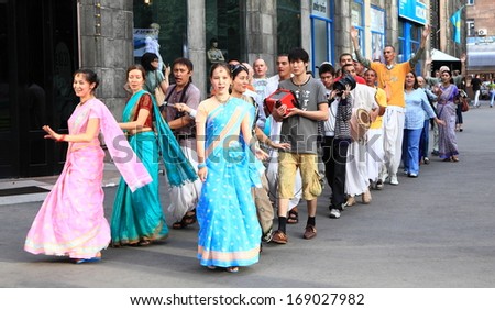 ALMATY, KAZAKHSTAN - June 26, 2010: Procession of dancing devotees from Hare Krishna moving on the center of capital of Kazakhstan