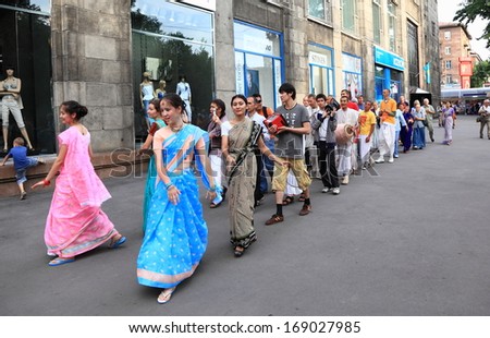 ALMATY, KAZAKHSTAN - June 26, 2010: Procession of dancing devotees from Hare Krishna moving on the center of capital of Kazakhstan