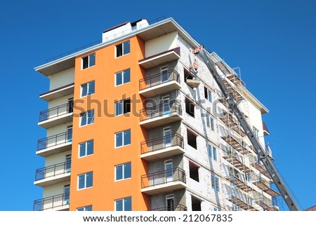 Modern building under construction on the blue sky background