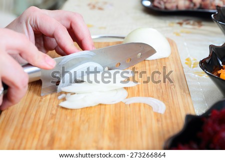 Ingredients for preparing russian traditional salad \'herring under fur coat\', chopping onion