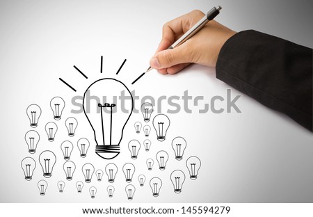 hand of business writing lamp and light