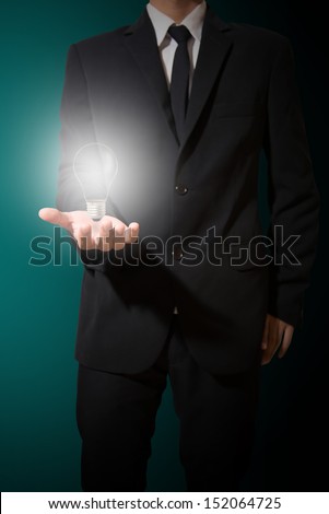 businessman hold lamp,figure out