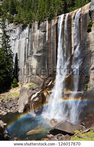 Hiking along the Myst Trail, it is possible to see water spray and myst creating a great rainbow at the Vernal Fall, Yosemite National Park, USA