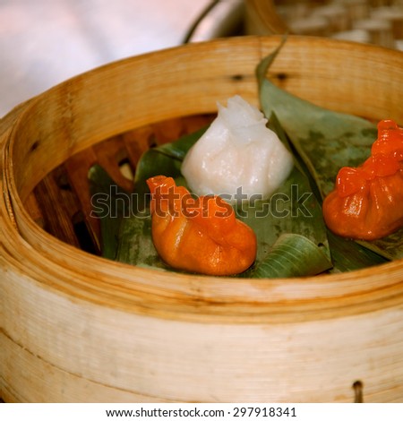 Cantonese cuisine. Dim sum cooked in steamer baskets.