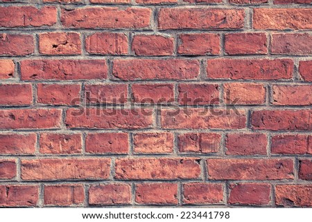 Closeup of a bright red vintage brick wall/Red Brick Wall Detail