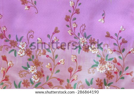 Flowers on pattern pink  cloth background.