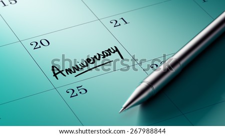 Closeup of a personal agenda with a Ballpoint pen marking a day of the month representing a schedule. Anniversary text note reminder concept. Words Anniversary written in Black Marker.