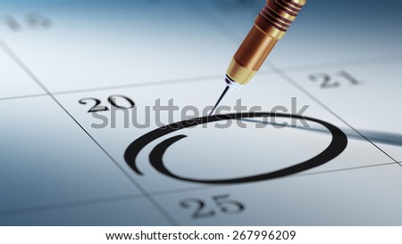 A dart stick on Calendar. Concept image of a Calendar with a shiny golden dart stick. Closeup shot of a dart attached.