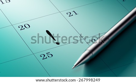 Closeup of a personal agenda with a Ballpoint pen marking a day of the month representing a organizing time and schedule.